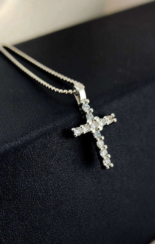 Platinum-plated cross. Simple, radiant, timeless.