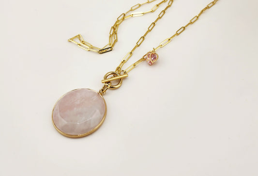 "An ode to love: rose quartz embraced in gold, crowned with a sparkling rose.”
