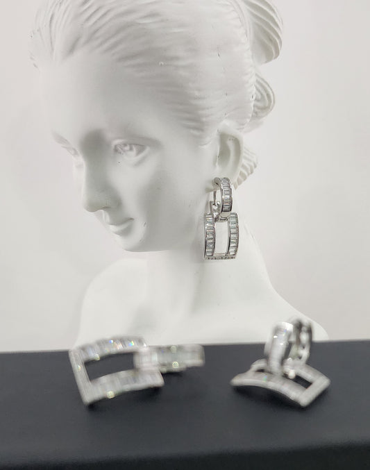 Platinum plated earrings with baguette-cut cubic zirconia in a bold geometric drop design.